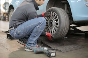 man-changing-a-car-tire-3806249